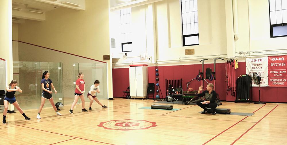 students stretching in the gym